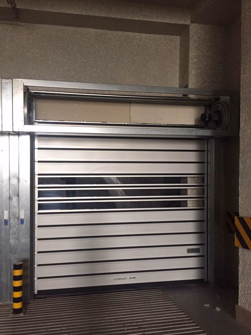 High speed rolling doors are industrial-grade rapid-access solutions designed for high-traffic areas. These durable doors feature aluminum or PVC slats that roll vertically at speeds up to 4m/s, optimizing workflow efficiency in warehouses, cleanrooms, and loading docks. With advanced safety sensors and energy-saving insulation options, they provide secure temperature control while reducing air infiltration by 80% compared to conventional doors. Their low-maintenance design and 100,000+ cycle lifespan make them ideal for food processing, logistics, and manufacturing facilities requiring frequent access. Automatic operation modes integrate seamlessly with forklift traffic and building management systems.